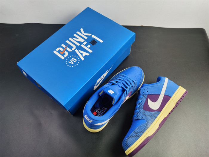 undefeated’s “dunk vs. af-1” collection grows with this snakeskin-dressed   dh6508-400