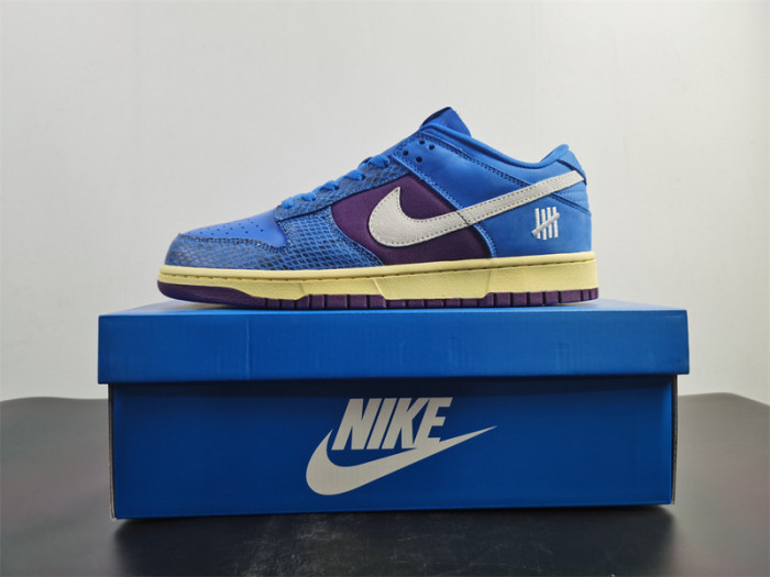 undefeated’s “dunk vs. af-1” collection grows with this snakeskin-dressed   dh6508-400